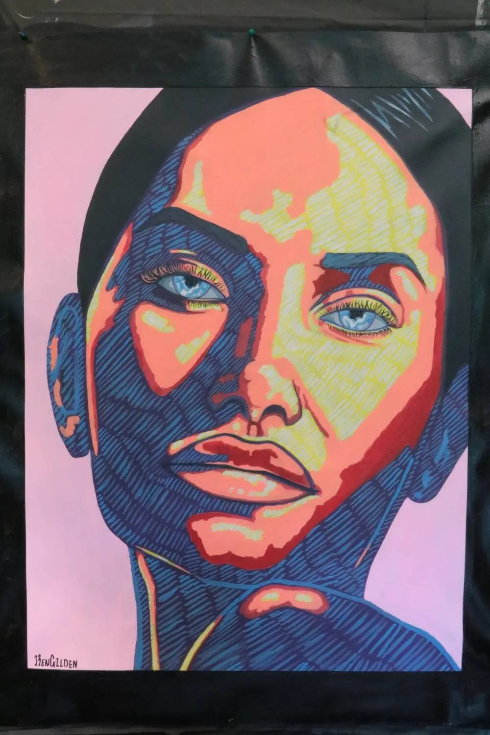 The Absence original abstract portrait by Ben Gilden, available at My Store, features a womans face with bold blue, pink, and red hues on a dark background. Her direct gaze and detailed features create drama with vibrant light play. Acrylic on 64 × 84 cm canvas enhances the vividness.